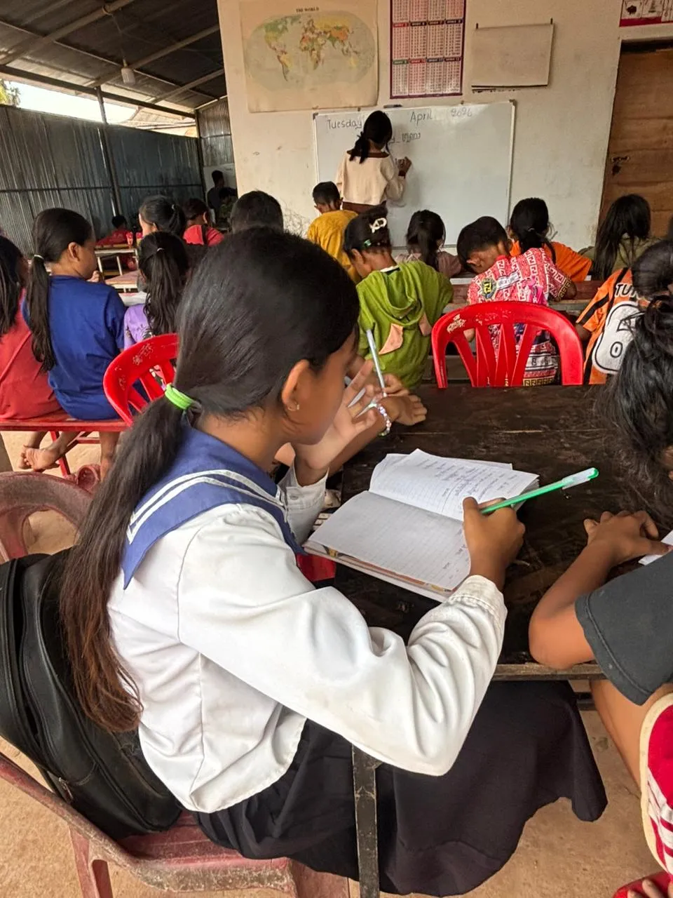 A student taking notes during class.