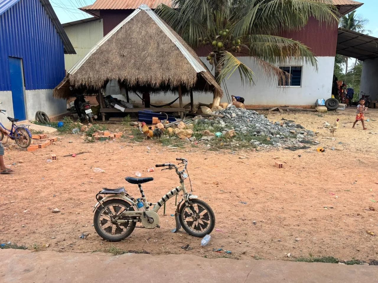 A child's bicycle in the village near the school.